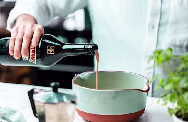 Pouring baileys into Pasteis de Baileys